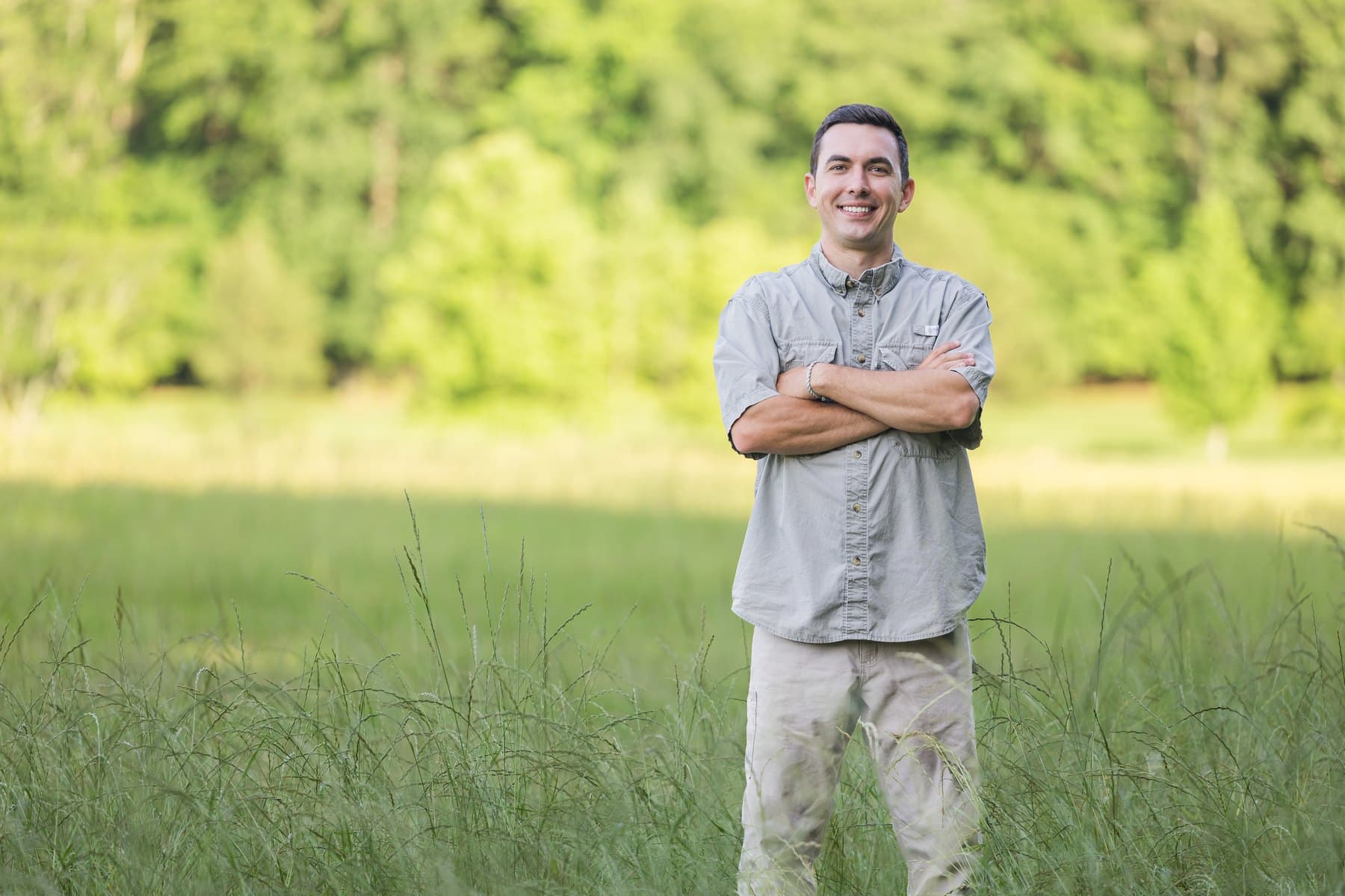 Jesse standing in a hayfield in Etowah County